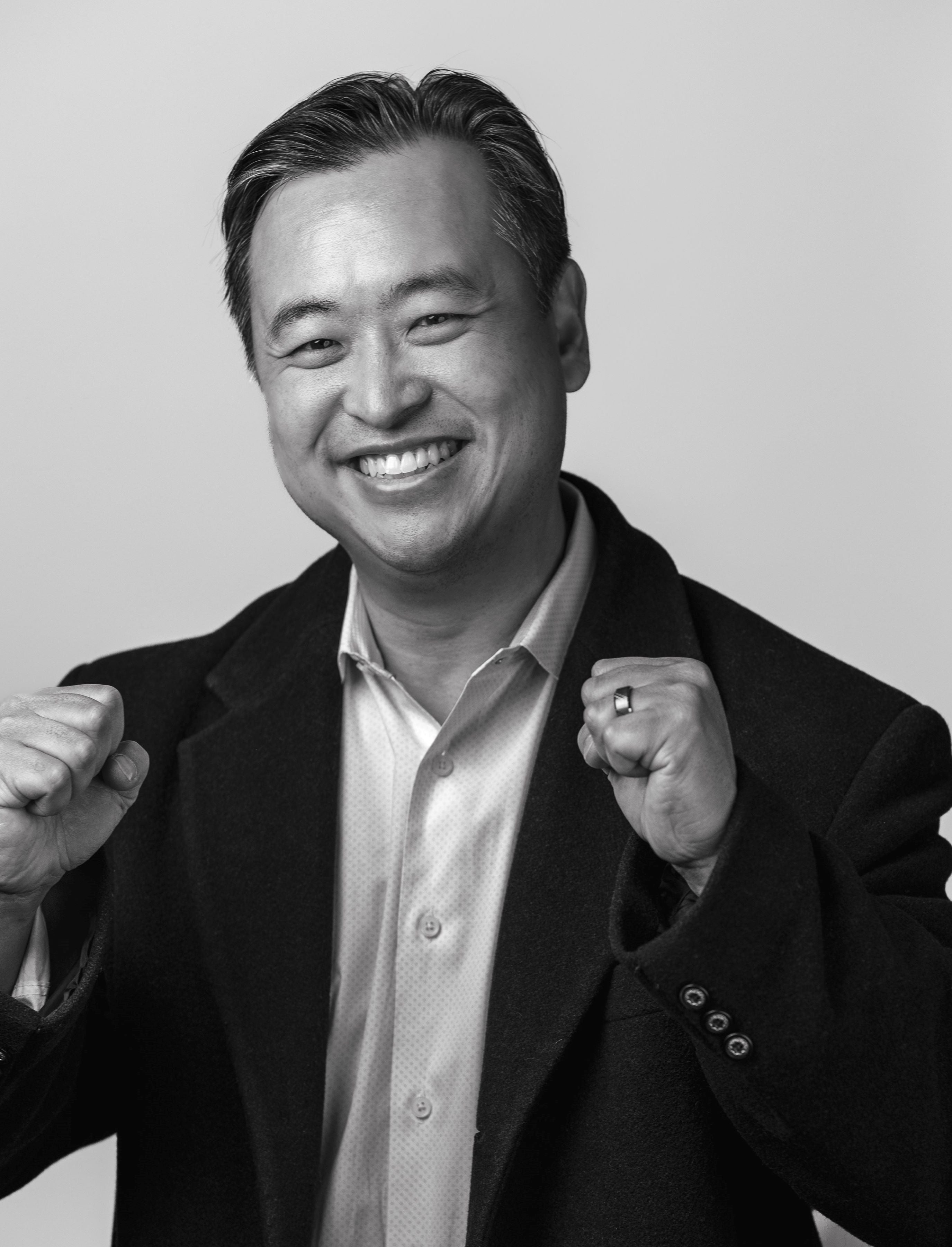 Portrait of Dr. David YC Yung, founder of Pomelo Biosciences, smiling and posing confidently